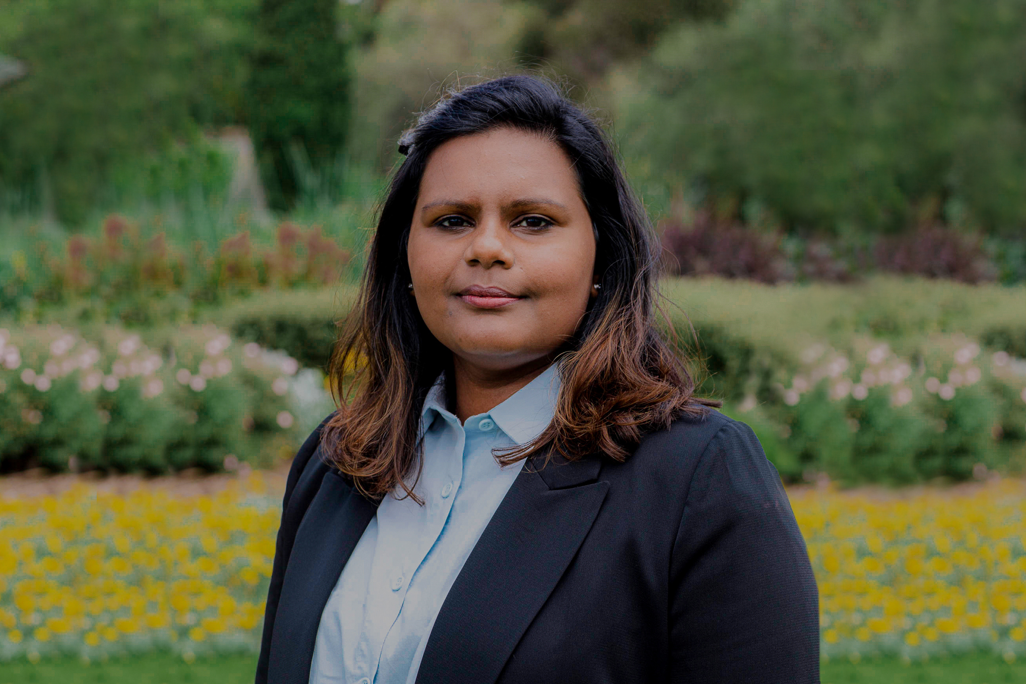 a corporate headshot portrait of civil structural design female engineer sumesha durais at the garden